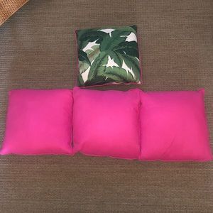 3 hot pink pillows